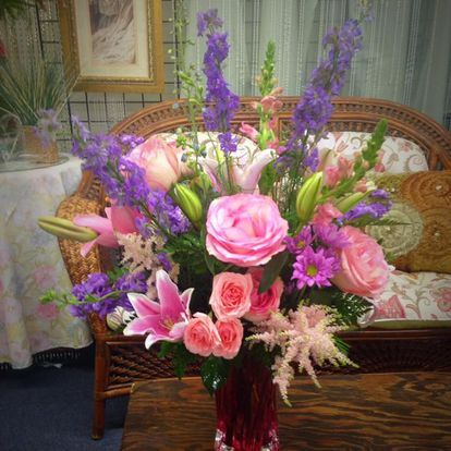 Pink lilies, roses and delphinium
